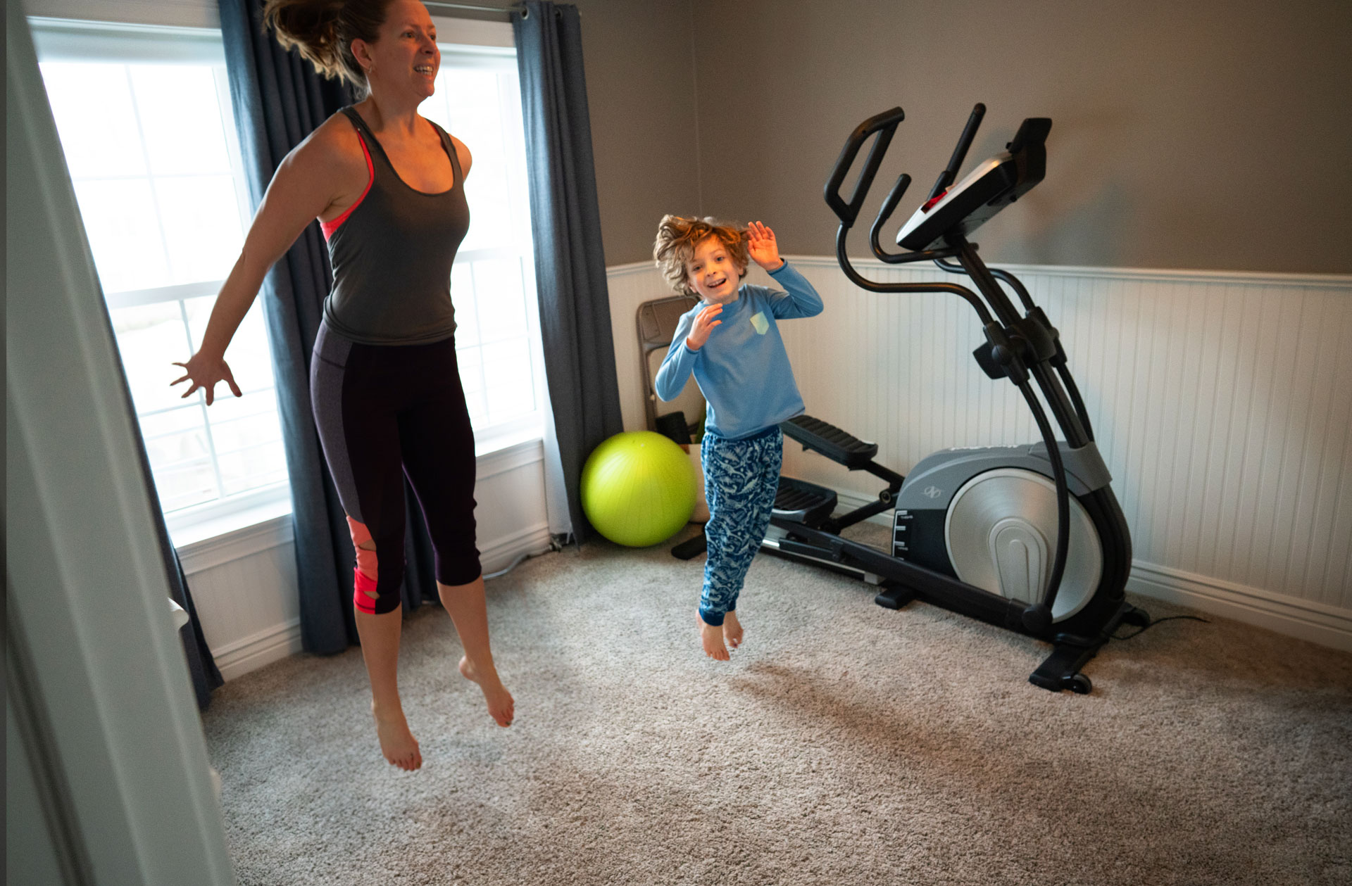 Mom and son jumping in the air